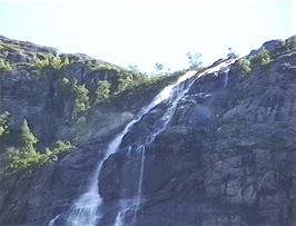 A waterfall cascades off the mountainside in the Storelva valley near Klakegg, 7.6 miles from Byrkjelo
